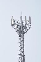 Equipment and transmission towers on clean sky background. Telecommunication. photo