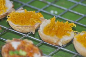 Starchy snacks have topping made of yolk. photo