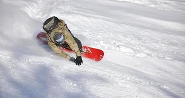 freestyle snowboarder jump and ride photo