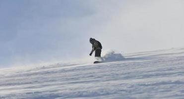 freestyle snowboarder jump and ride photo