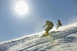 freestyle snowboarder jump and ride photo