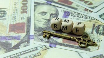 rmf wooden cube  and gold keyon banknotes for business content. photo
