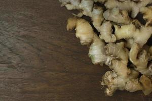 Ginger on wood plate for food content. photo