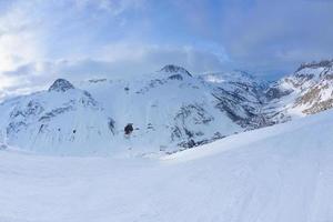 skiing on fresh snow at winter season at beautiful sunny day photo