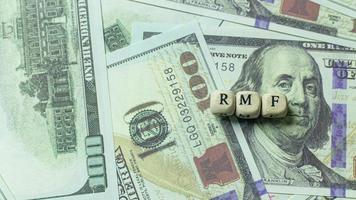 rmf wooden cube on banknotes for business content. photo