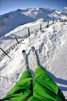 skiing on fresh snow at winter season at beautiful sunny day photo