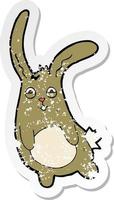 retro distressed sticker of a funny cartoon rabbit vector