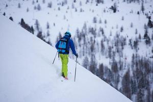 freeride skier skiing downhill photo