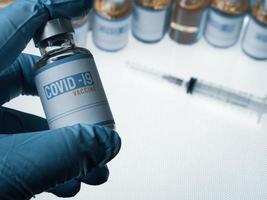 vaccine covid 19 in bottle for medical content. photo