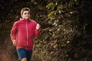 man jogging along a country road photo