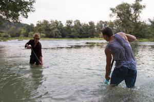 young men having fun with water guns photo