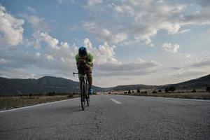 triathlon athlete riding bike photo