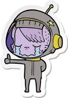 sticker of a cartoon crying astronaut girl making thumbs up sign vector