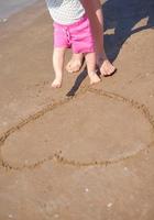 mom and baby on beach  have fun photo