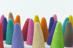 Incense Cone in a stand with the feather for background. photo