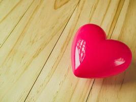 pink heart on wood table for Health and medical content. photo