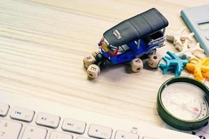 tuktuk on white  office  table for travel content. photo