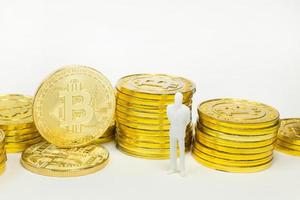 white miniature and gold coin bitcoin abstract image close up background. photo