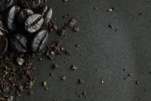 The  coffee roasted on  black texture close up background. photo