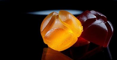 Beautiful multicolored marmalade candy with reflection. photo