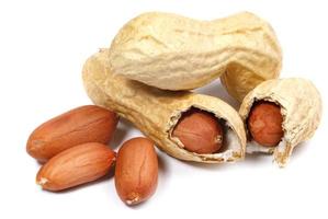 Peanuts in shell and peeled isolated on a white background. photo