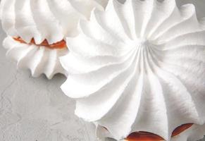 Two snow-white meringues. Beautiful white cake. photo