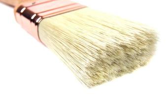 A new beautiful painting brush on a white background. photo