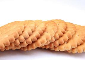 a row of round crackers on a white background. photo
