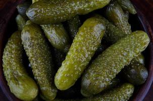 Background of a lot of pickled cucumbers. Salted cucumbers. photo