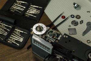 The vintage camera film service, adjustment and alignment. Camera lens repair photo