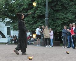 Unplugged free street event fire eater street artist. High quality photo