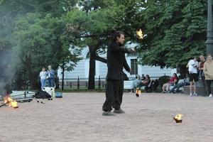 Unplugged free street event fire eater street artist. photo