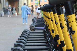 Electric scooters lined up photo