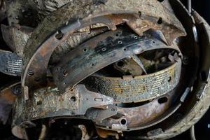 Many old used brake shoes photo