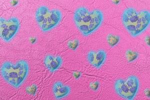 Abstract colorful  heart isolated on pink leather or paper texture with palm leaves pattern background,valentine day and love concept. photo