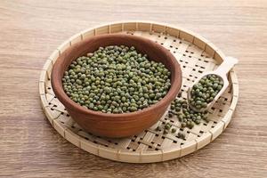 Group of green mung beans served on wooden bowl. Food preparation