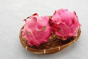 Fresh Dragon Fruits, Buah Naga, on white background. photo