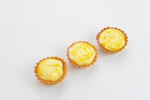 Golden Brown Fresh Cheese Tart isolated on white background photo