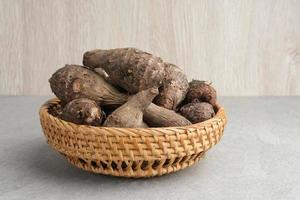 Taro, Talas belitung, kimpul or bentul, are starchy tubers that can be eaten. Served boiled or steamed. photo