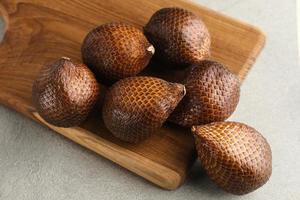 Salak or thorny palm or snake fruit, Salacca zalacca is a species of palm tree. Selective focus image. photo