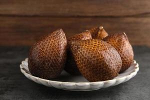 Salak or thorny palm or snake fruit, Salacca zalacca is a species of palm tree. Selective focus image. photo