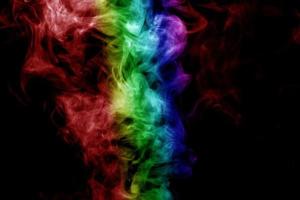 Abstract smoke isolated on black background,Rainbow powder photo