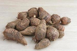 Taro, Talas belitung, kimpul or bentul, are starchy tubers that can be eaten. Served boiled or steamed. photo