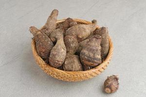 Taro, Talas belitung, kimpul or bentul, are starchy tubers that can be eaten. Served boiled or steamed. photo