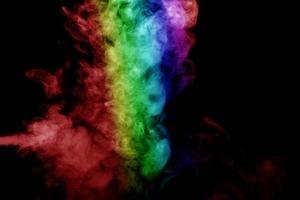 Abstract smoke isolated on black background,Rainbow powder photo