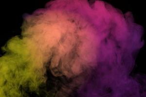 Abstract smoke isolated on black background,Rainbow powder photo