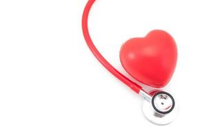 Stethoscope and red heart on white background photo