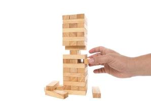 Wood block tower game on white background.Challenge In Business Concep photo