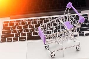 Tablet and shopping cart, Online shopping concept photo