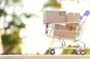 Paper boxes in a trolley with copy-space,Shopping online concept photo